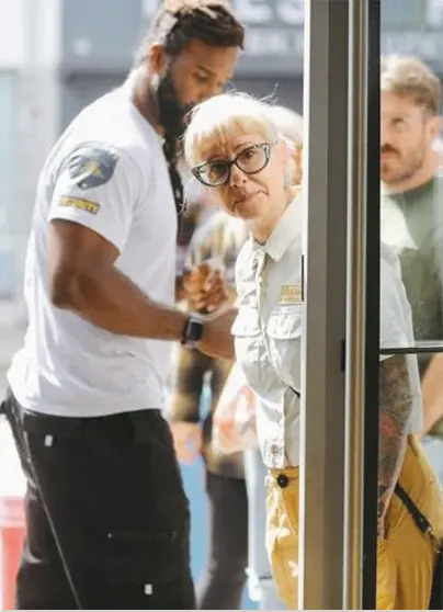 Lavres guard interacting with a guest at a venue entrance